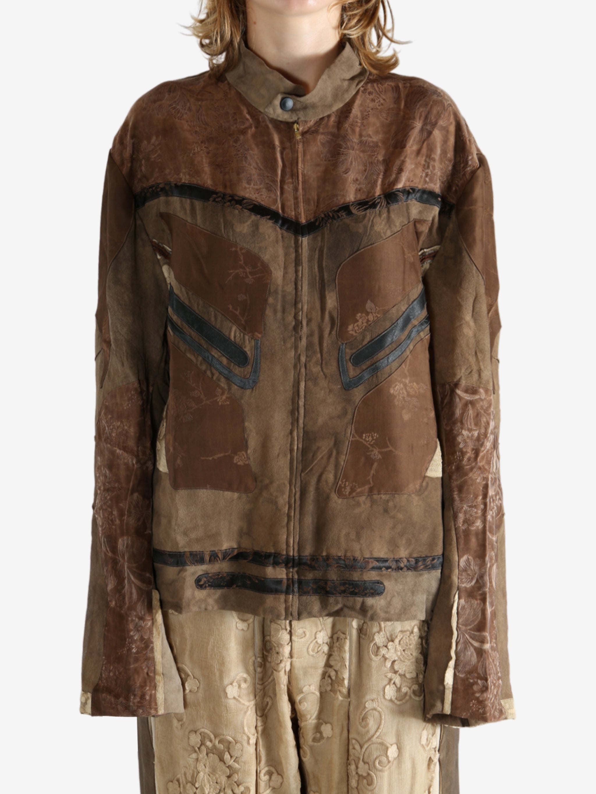 Brown jacket worn by a person, showing the jacket fit