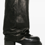 Close up of the black jeans, showing texture of the lanb skin fabric