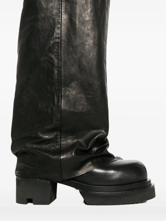 Close up of the black jeans, showing texture of the lanb skin fabric