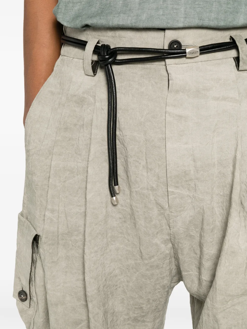 Tan pants worn by a person, showing the pants fit