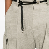 Tan pants worn by a person, showing the pants fit