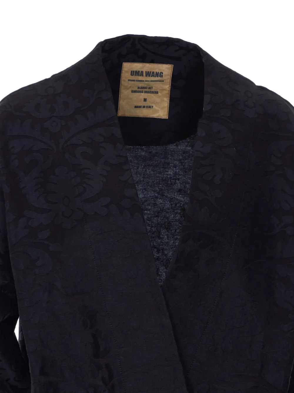 Close up of the black coats, showing texture of the blended fabric 