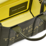 Close up of green bags, showing texture of the cow leather fabric