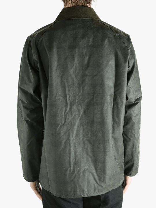 Green jacket worn by a person, showing the jacket's fit