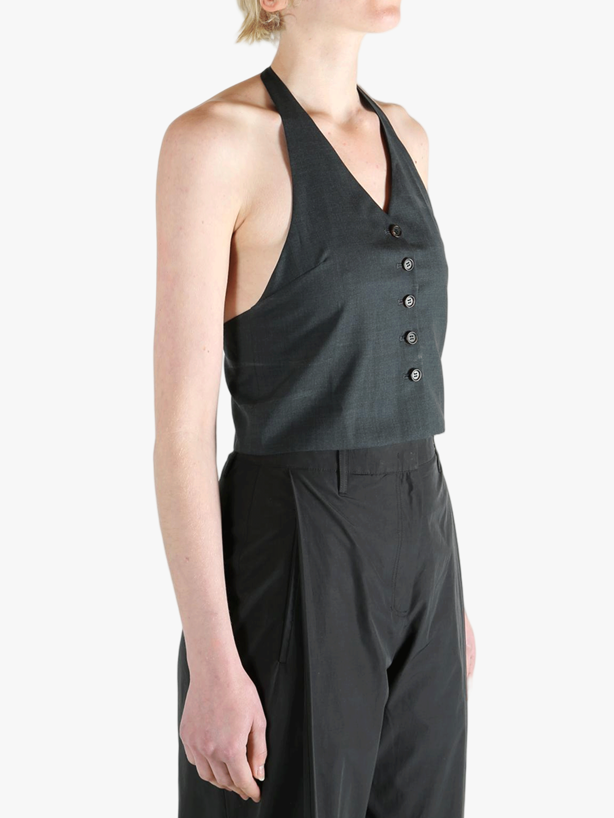 Black top worn by a person, showing the top's fit