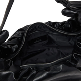 Close up of black bag,showing texture of the polyurethane fabric.
