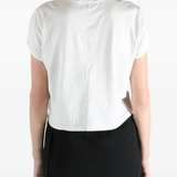 White t-shirt worn by a person, showing the t-shirt fit