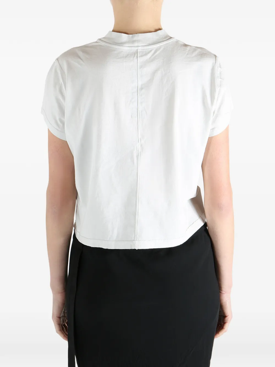 White t-shirt worn by a person, showing the t-shirt fit