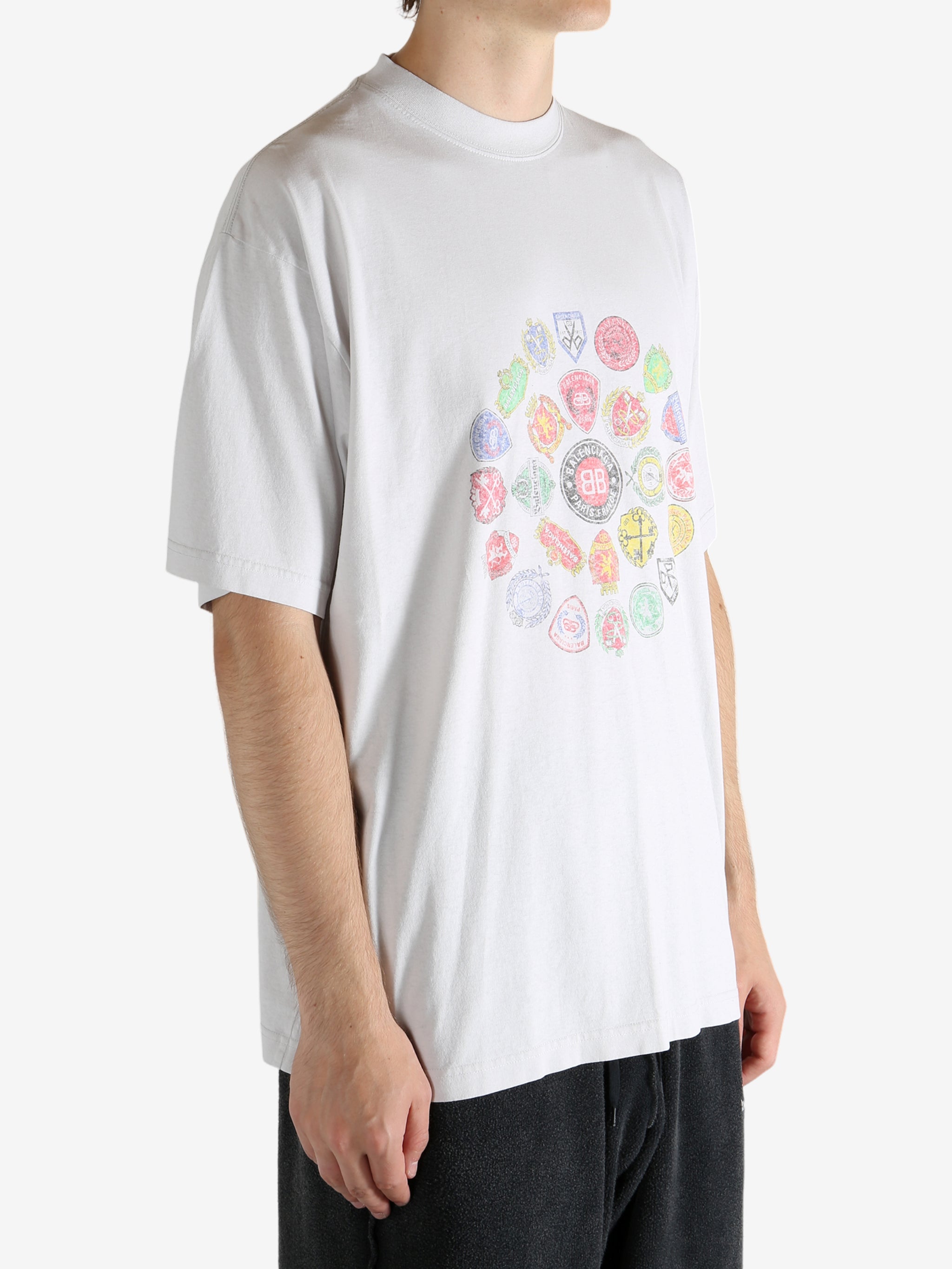 White t-shirt worn by a person, showing the t-shirt's fit