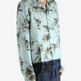 Green shirt worn by a person, showing the shirt's fit