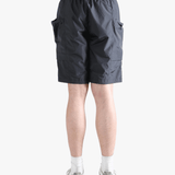 Gray shorts worn by a person, showing the short fit