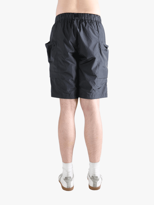 Gray shorts worn by a person, showing the short fit