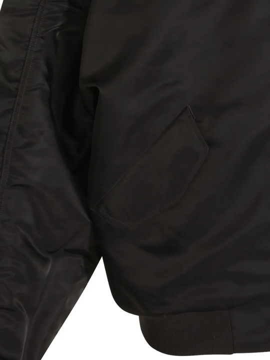 Close up of Grey jacket, showing texture of the 100% nylon fabric