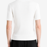 White hoodie worn by a person, showing the hoodie fit