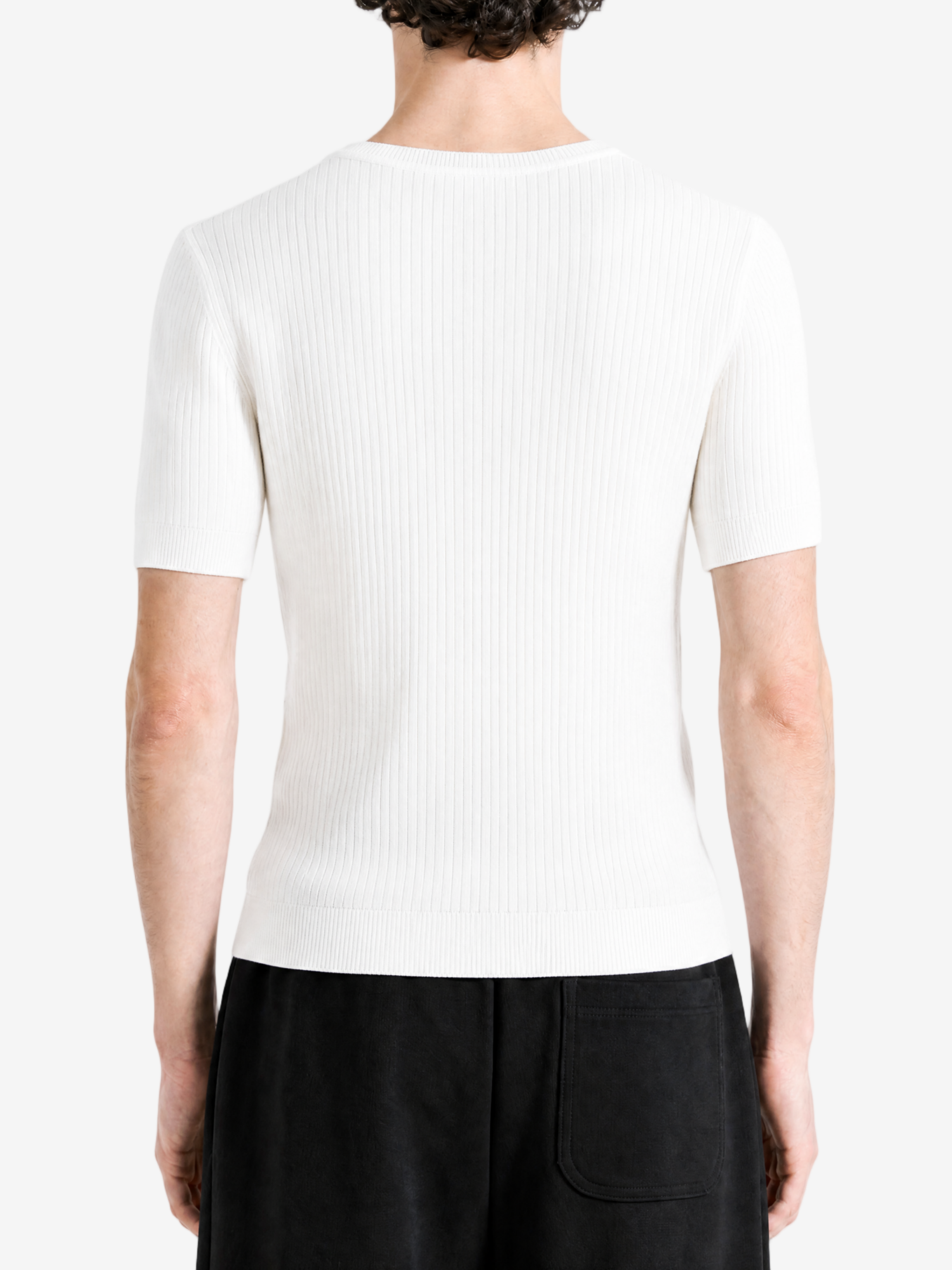 White hoodie worn by a person, showing the hoodie fit