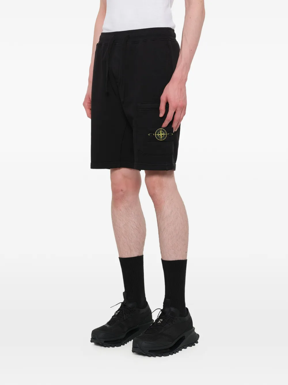 Black shorts warn a person,showing the shorts fit