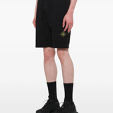 Black shorts warn a person,showing the shorts fit