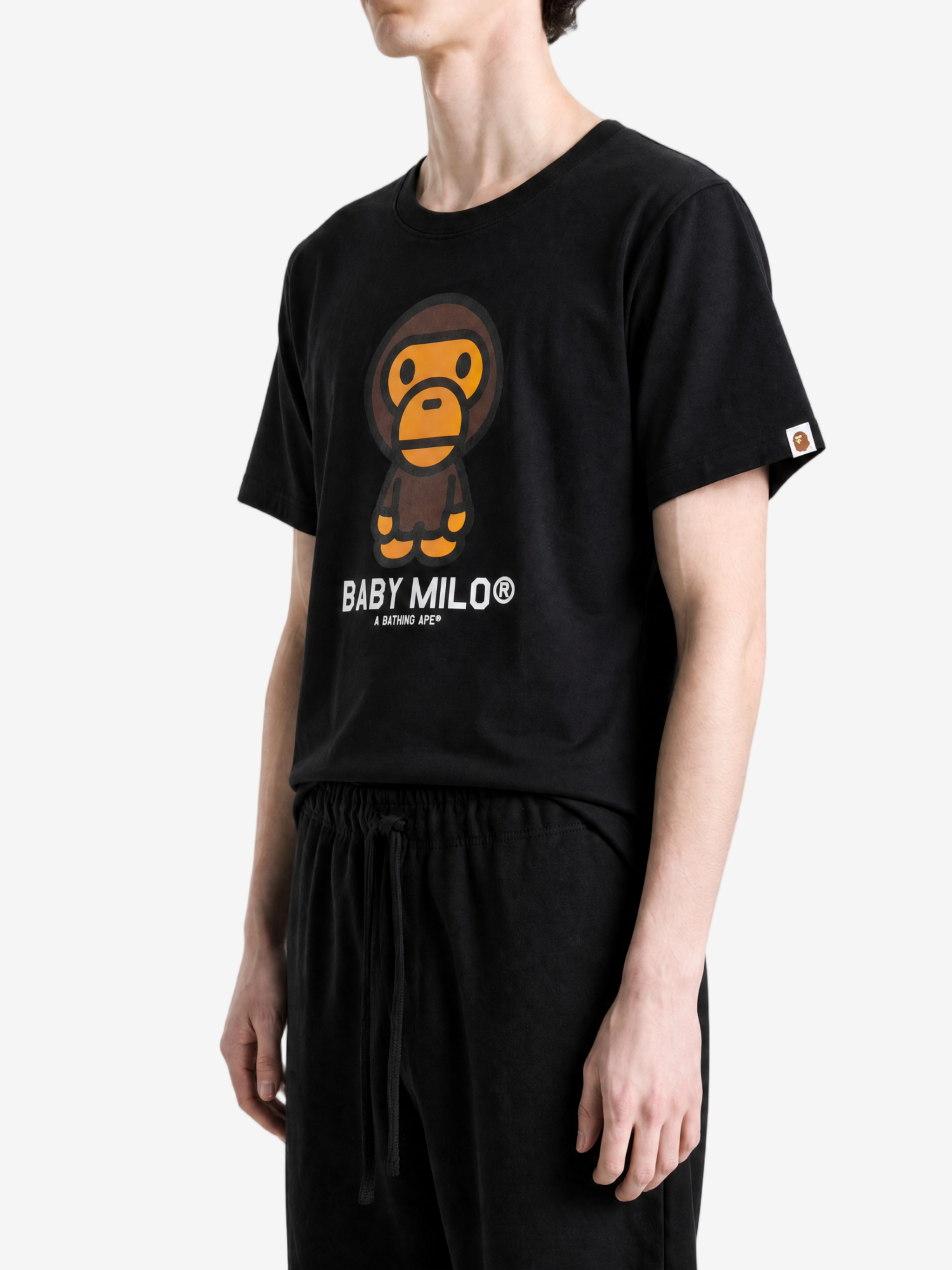 Black t-shirt worn by a person, showing the t-shirt fit