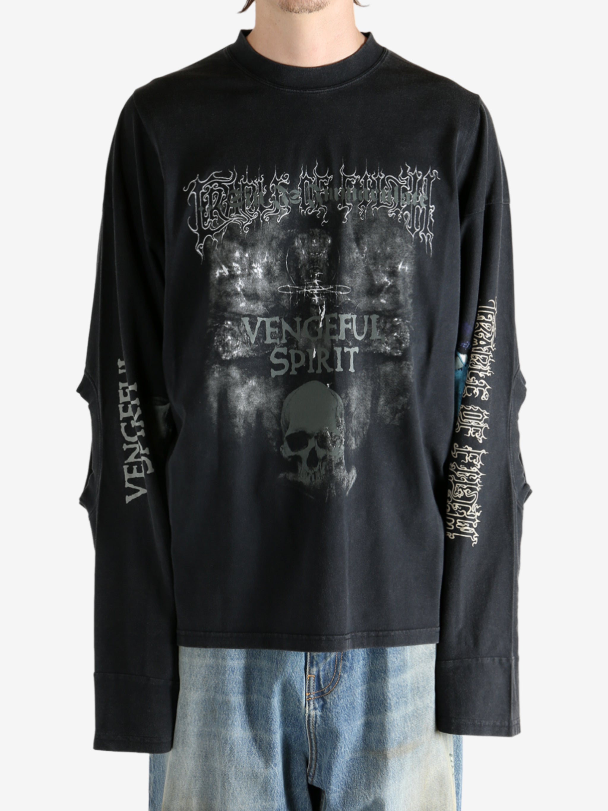 Black shirt worn by a person, showing the shirt fit