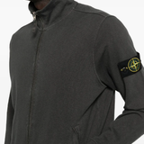 Close up of the grey jacket, showing texture of the cotton fabric