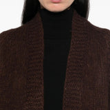 Brown knitwear worn by a person, showing the knitwear fit