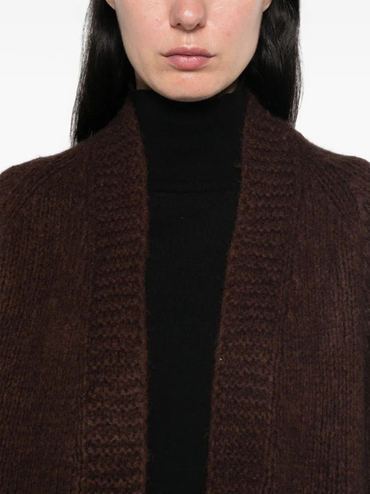 Brown knitwear worn by a person, showing the knitwear fit