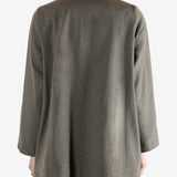 Grey coat worn by a person, showing the coat fit