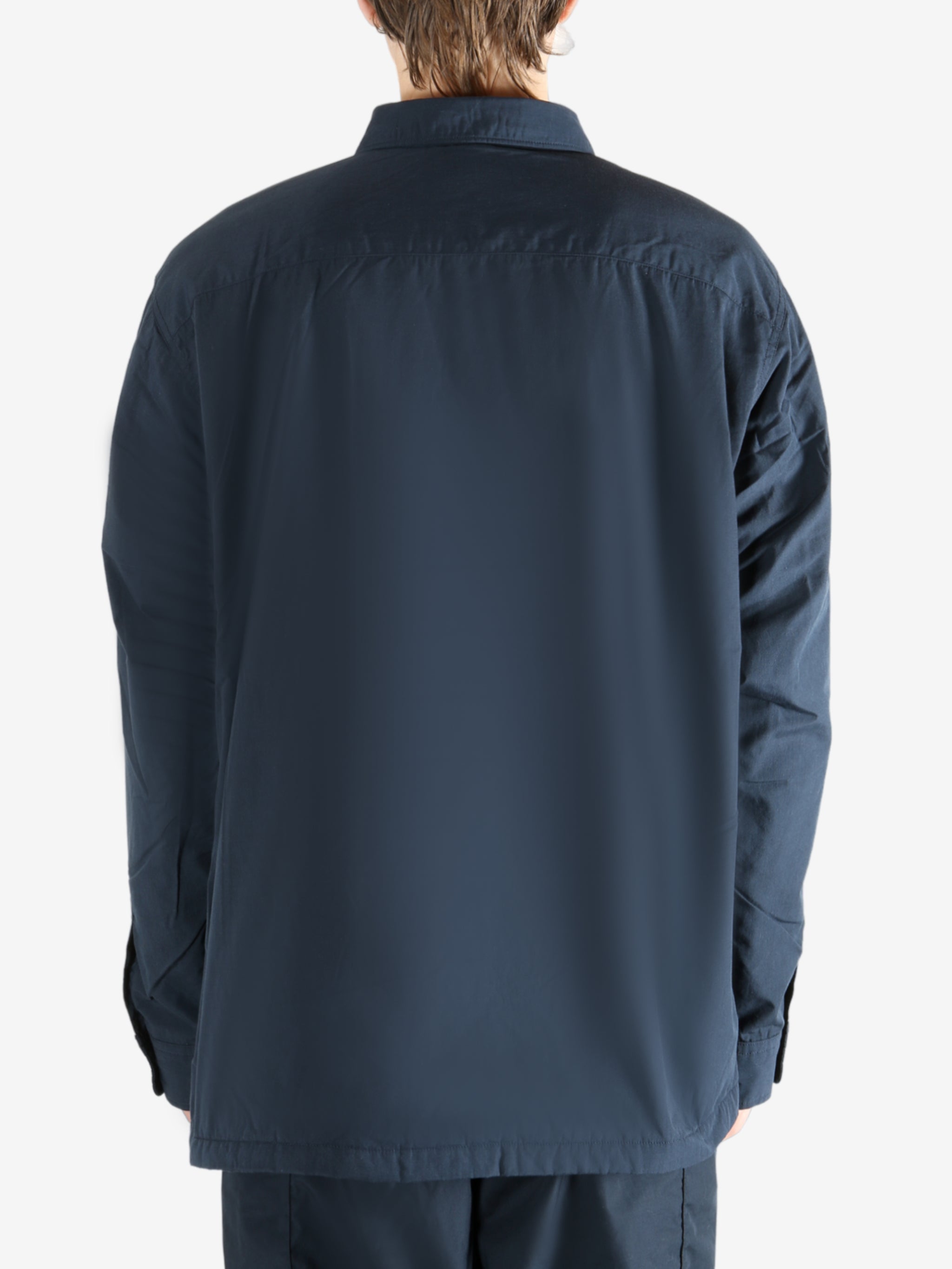 Navy jacket worn by a person, showing the jacket's fit