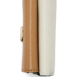 Close up of the tan bag, showing texture of the leather fabric