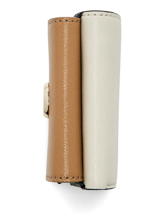 Close up of the tan bag, showing texture of the leather fabric