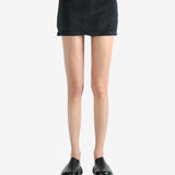 Black skirt worn by a person, showing the skirt's fit