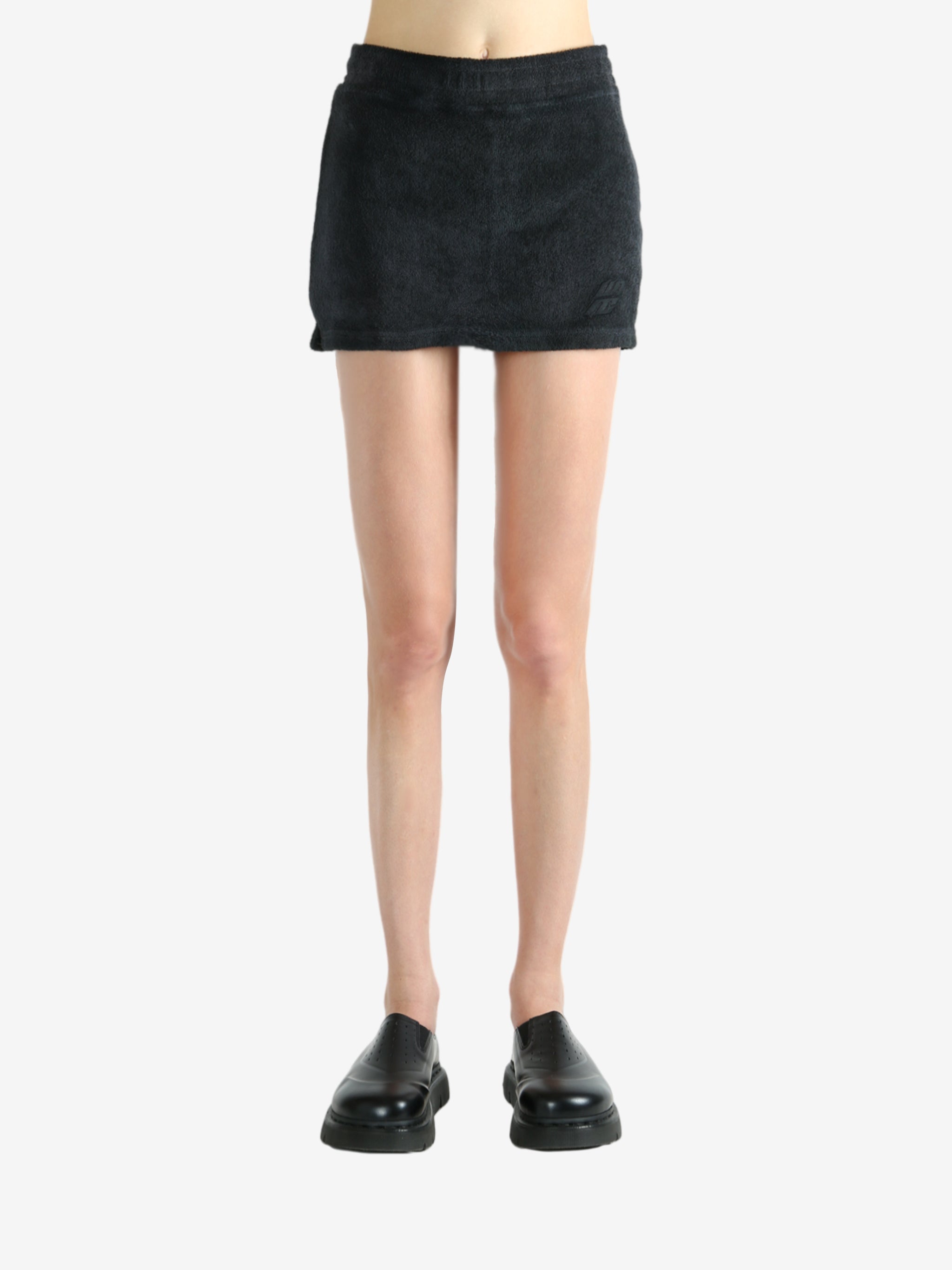 Black skirt worn by a person, showing the skirt's fit