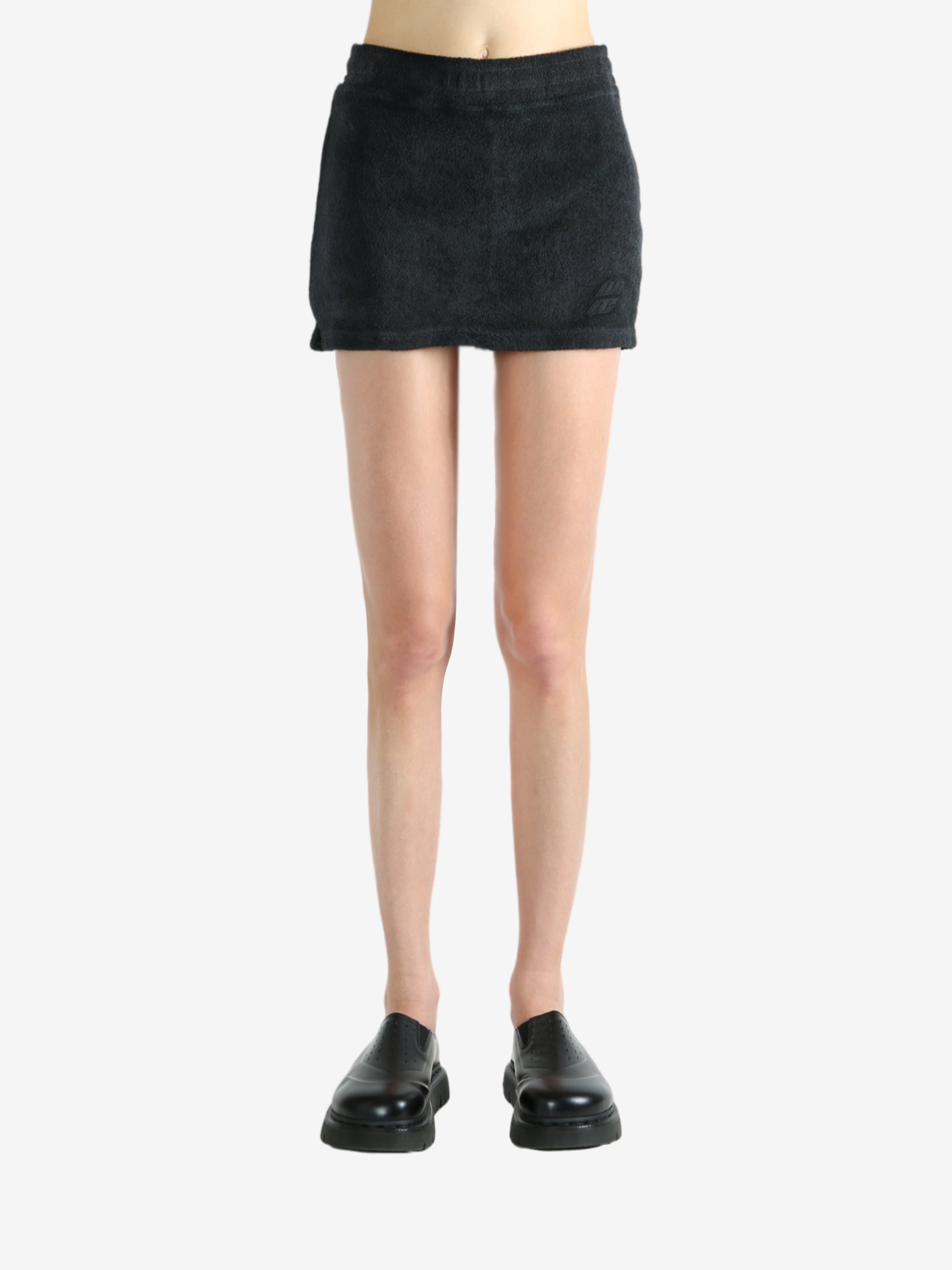 Black skirt worn by a person, showing the skirt's fit