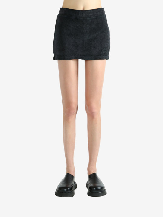 Black skirt worn by a person, showing the skirt's fit