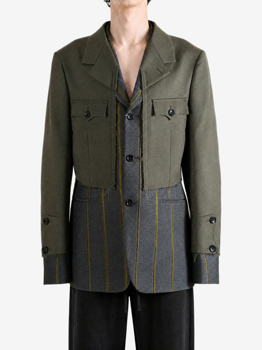 Green jacket worn by a person, showing the jacket fit