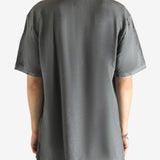 Grey T-shirt worn by a person, showing the T-shirt's fit