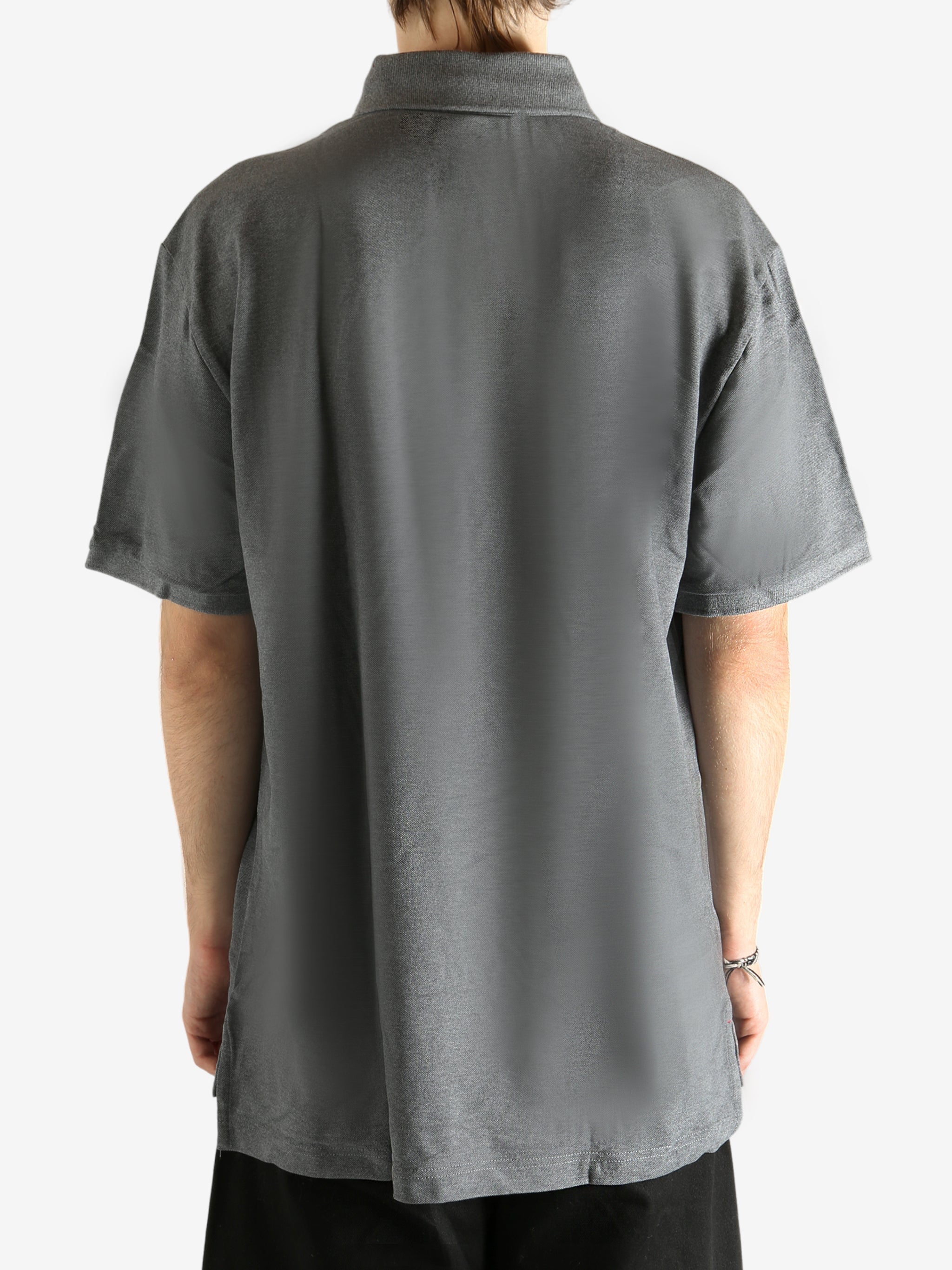 Grey T-shirt worn by a person, showing the T-shirt's fit