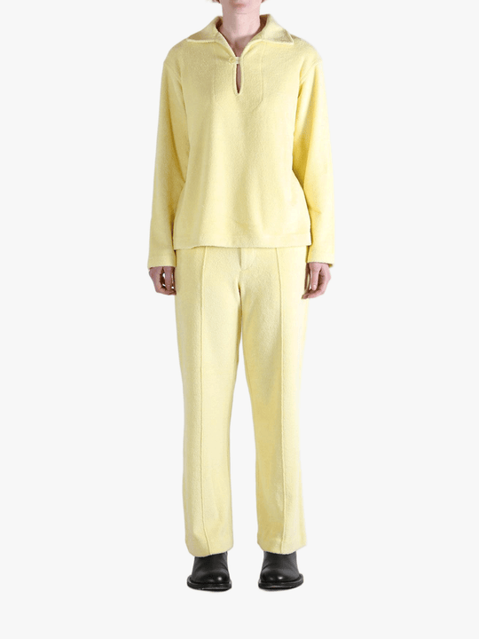 Yellow shirt worn by a person, showing the shirt's fit