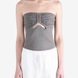 Grey top worn by a person, showing the top fit