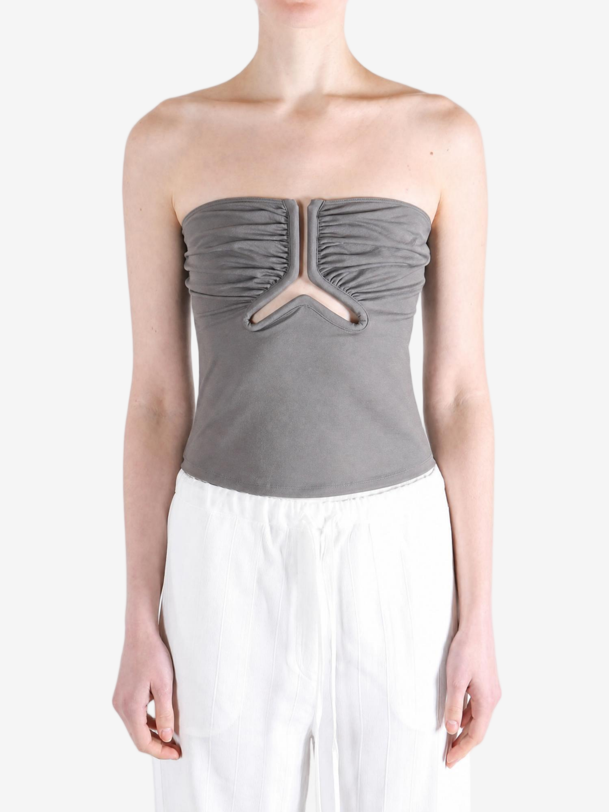 Grey top worn by a person, showing the top fit