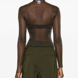 White top worn by a person, showing the tops fit