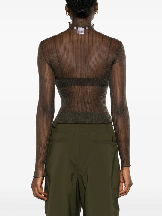 White top worn by a person, showing the tops fit