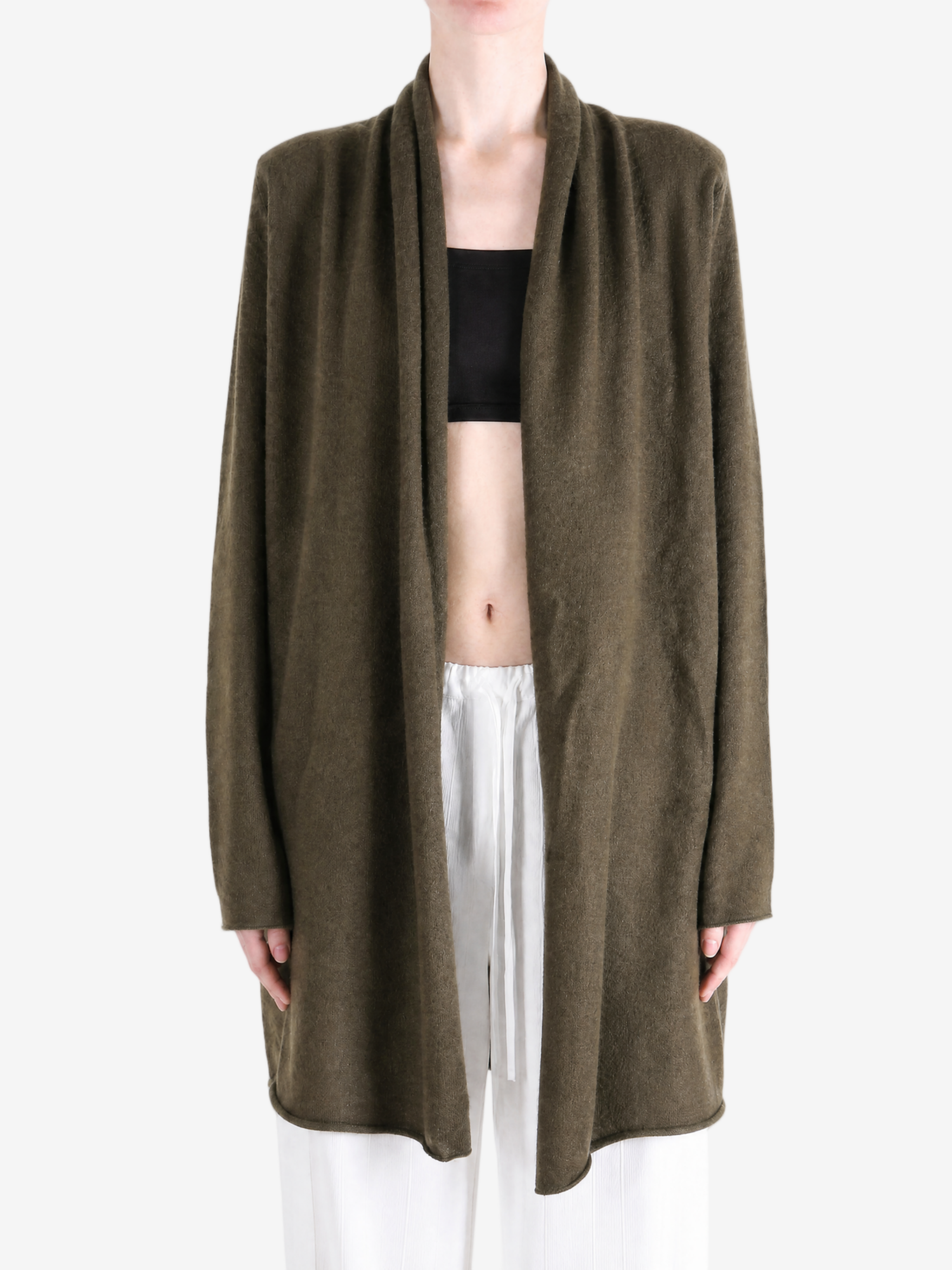 Brown knitwear worn by a person, showing the knitwear fit