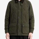 Green jacket worn by a person, showing the jacket fit