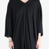 Black t-shirt worn by a person, showing the t-shirt fit