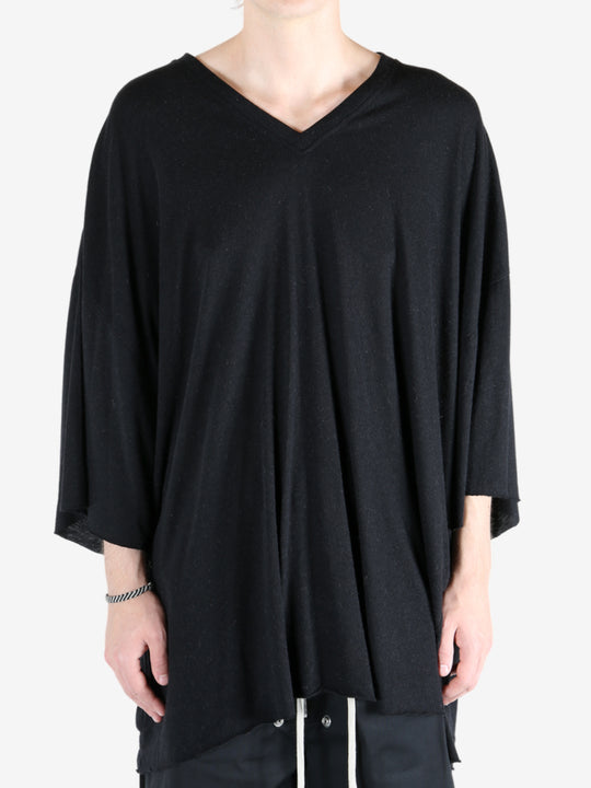 Black t-shirt worn by a person, showing the t-shirt fit