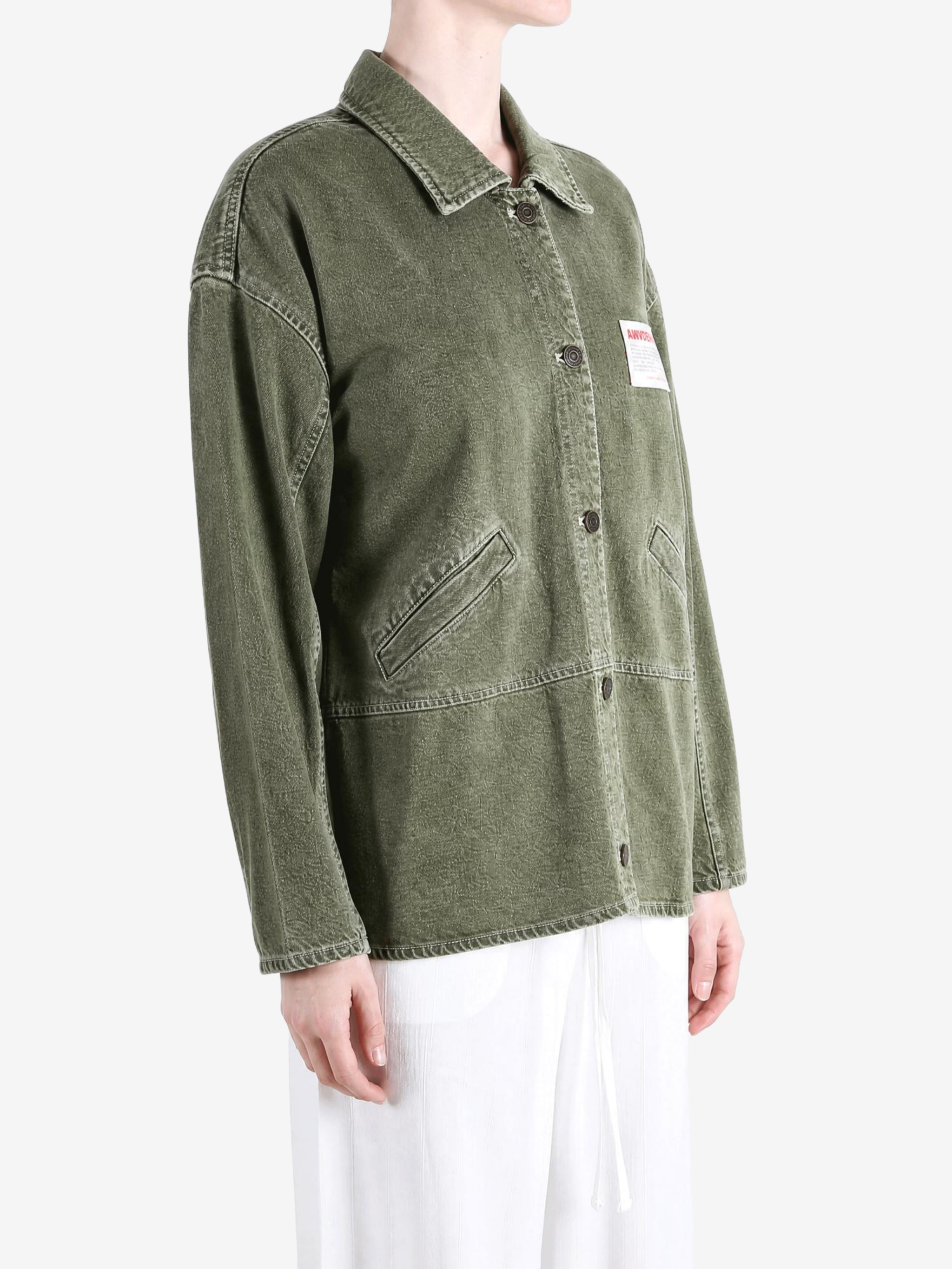 Green jacket worn by a person, showing the jacket fit
