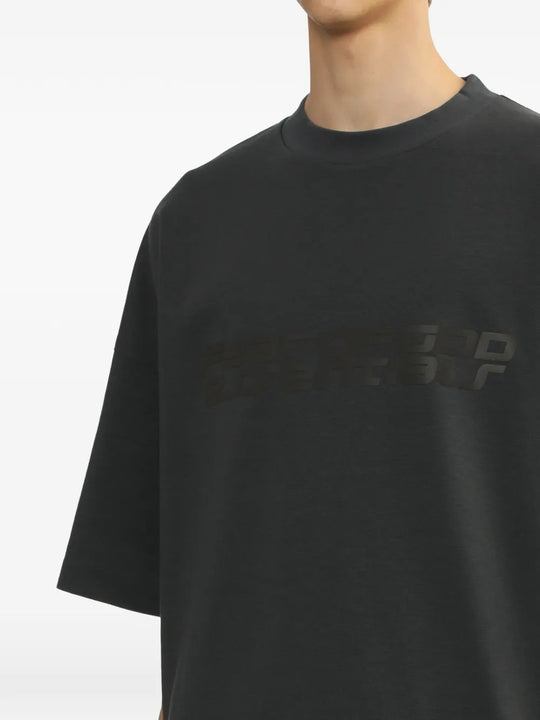 Close up of the grey t-shirt, showing texture of the cotton fabric