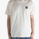 White t-shirt worn by a person, showing the shirt's fit