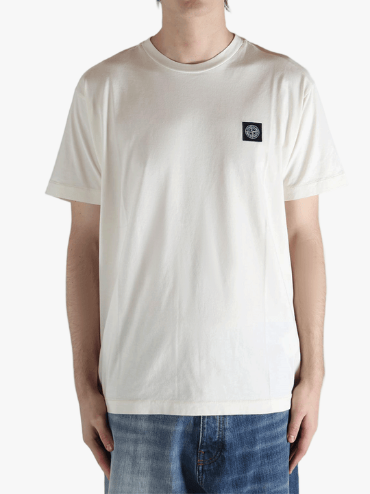 White t-shirt worn by a person, showing the shirt's fit